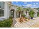 Inviting front entrance with manicured landscaping and decorative stone pathway at 32015 Summerglade Dr, Wesley Chapel, FL 33545