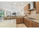 Modern kitchen with tile backsplash, stainless steel appliances, and granite countertops at 32015 Summerglade Dr, Wesley Chapel, FL 33545