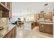 Open concept kitchen with granite countertops, stainless steel appliances, and pendant lighting at 32015 Summerglade Dr, Wesley Chapel, FL 33545