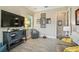 Cozy living room showcasing a large television and decorative furnishings at 32015 Summerglade Dr, Wesley Chapel, FL 33545