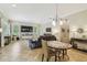Open living area with tile flooring, large windows, and comfortable seating arrangement at 32015 Summerglade Dr, Wesley Chapel, FL 33545