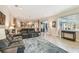 Spacious living area featuring tile floors, recessed lighting, and modern furnishings at 32015 Summerglade Dr, Wesley Chapel, FL 33545