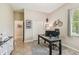 Home office with a dark desk and a view to the hallway at 32015 Summerglade Dr, Wesley Chapel, FL 33545