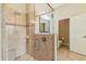 This tiled shower features a rain shower head and integrated bench at 32015 Summerglade Dr, Wesley Chapel, FL 33545