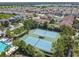 Aerial view of well-maintained community tennis courts surrounded by lush landscaping and trees at 32015 Summerglade Dr, Wesley Chapel, FL 33545