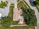 Aerial view of the property with a well-maintained roof, green lawn, and shaded patio area at 3242 Brushwood Ct, Clearwater, FL 33761