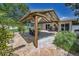 A spacious backyard featuring a pergola, brick patio, and manicured landscaping at 3242 Brushwood Ct, Clearwater, FL 33761