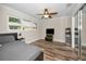 Bedroom featuring dark bed frame, ceiling fan, and closet at 3242 Brushwood Ct, Clearwater, FL 33761