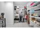 Spacious walk-in closet featuring ample shelving and rod space for organized storage at 3242 Brushwood Ct, Clearwater, FL 33761
