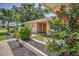 Close-up of front entrance featuring a well-manicured garden and double-door entry at 3242 Brushwood Ct, Clearwater, FL 33761