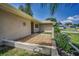 A charming front yard with unique decorative elements enhancing curb appeal at 3242 Brushwood Ct, Clearwater, FL 33761
