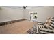 Spacious living room features sliding glass doors and wood-look flooring at 3242 Brushwood Ct, Clearwater, FL 33761