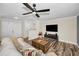 Spacious living room with modern ceiling fan and sleek wood flooring at 3242 Brushwood Ct, Clearwater, FL 33761