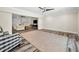 Expansive open living room showcasing neutral paint and wood-look floors at 3242 Brushwood Ct, Clearwater, FL 33761