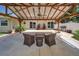 Large outdoor pergola with ceiling fan, patio furniture, and landscaping for outdoor enjoyment at 3242 Brushwood Ct, Clearwater, FL 33761