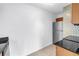 Kitchen area featuring stainless steel refrigerator, mosaic tile backsplash, and granite countertops at 3300 Haviland Ct # 103, Palm Harbor, FL 34684