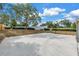 Private basketball court is perfect for exercise and outdoor games with lush green landscaping at 3305 Haviland Ct # 101, Palm Harbor, FL 34684