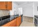 Kitchen with black granite counter and stainless dishwasher at 3305 Haviland Ct # 101, Palm Harbor, FL 34684