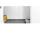 An empty storage space with grey floors is ready to be filled at 3305 Haviland Ct # 101, Palm Harbor, FL 34684