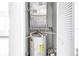 The utility closet features a water heater and HVAC system at 3305 Haviland Ct # 101, Palm Harbor, FL 34684