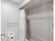 This bathroom features tile walls, a toilet, shower, and tub combination at 3425 W Forest Lake Cir, Sarasota, FL 34232