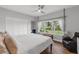Bedroom features wood floors, bright windows, a ceiling fan, and a closet at 3425 W Forest Lake Cir, Sarasota, FL 34232