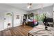 Bright bedroom with a ceiling fan, view to the backyard, and wood-look flooring at 3425 W Forest Lake Cir, Sarasota, FL 34232