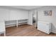 Spacious bonus room with built-in cabinets and modern flooring at 3425 W Forest Lake Cir, Sarasota, FL 34232