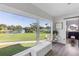 Bright hallway with large windows offering a view of the lake at 3425 W Forest Lake Cir, Sarasota, FL 34232