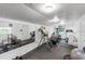 Bright, fully equipped home gym with rubber flooring and motivational decor for fitness enthusiasts at 3425 W Forest Lake Cir, Sarasota, FL 34232