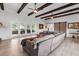 Spacious living room with wood floors, high ceilings, and glass doors to the patio at 3425 W Forest Lake Cir, Sarasota, FL 34232