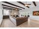 Open-concept living room with a fireplace and views of the outdoor patio at 3425 W Forest Lake Cir, Sarasota, FL 34232