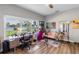 Bright home office with neutral gray paint and a view of the backyard pond at 3425 W Forest Lake Cir, Sarasota, FL 34232
