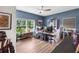 Bright home office features blue accent walls, natural light, and wood floors at 3425 W Forest Lake Cir, Sarasota, FL 34232