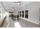 Bright sunroom featuring multiple windows and sliding doors offering plenty of natural light and exterior views at 3425 W Forest Lake Cir, Sarasota, FL 34232