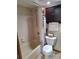 Bathroom with a combined tub and shower, tropical-themed curtain, and dark wood storage at 3536 Countrybrook Ln # 13, Palm Harbor, FL 34684