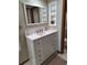 Bathroom with a vanity, framed mirror, and linen tower at 3536 Countrybrook Ln # 13, Palm Harbor, FL 34684