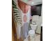 Bathroom showcasing a tropical print shower curtain and dark wood cabinet at 3536 Countrybrook Ln # 13, Palm Harbor, FL 34684