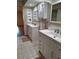 Bathroom featuring double sink vanity with tile flooring at 3536 Countrybrook Ln # 13, Palm Harbor, FL 34684