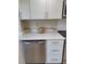 Chic kitchen with quartz counters, stainless steel appliances, and white cabinets at 3536 Countrybrook Ln # 13, Palm Harbor, FL 34684