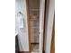Bathroom linen closet with multiple shelves and a bi-fold door for storage at 3536 Countrybrook Ln # 13, Palm Harbor, FL 34684