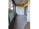 Enclosed patio with tile flooring and storage closet at 3536 Countrybrook Ln # 13, Palm Harbor, FL 34684