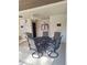 Poolside patio featuring seating arrangement under covered area at 3536 Countrybrook Ln # 13, Palm Harbor, FL 34684