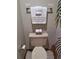 A clean and well-maintained toilet with fresh towels and modern fixtures at 3536 Countrybrook Ln # 13, Palm Harbor, FL 34684