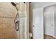 Bathroom featuring a tiled shower with glass doors and white fixtures at 3673 Fremantle Dr, Palm Harbor, FL 34684