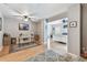 Open floor plan with bedroom and an office area with wood laminate flooring at 3673 Fremantle Dr, Palm Harbor, FL 34684