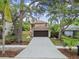 Charming two-story home with a well-manicured lawn, two-car garage and mature trees in a desirable community at 3673 Fremantle Dr, Palm Harbor, FL 34684