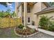 Charming home featuring a garden, fresh landscaping, and a inviting front entrance at 3673 Fremantle Dr, Palm Harbor, FL 34684
