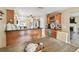 Elegant kitchen features countertop seating, a wine rack, and seamlessly flows to the living area at 3673 Fremantle Dr, Palm Harbor, FL 34684