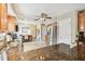 Bright kitchen with wood cabinets and stainless refrigerator leads to the dining area at 3673 Fremantle Dr, Palm Harbor, FL 34684